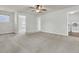 Bright bonus room with carpet, ceiling fan, and multiple entrances to other rooms, including the laundry room at 423 Watershed Dr, Goose Creek, SC 29445