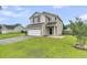 Charming two-story home with a manicured lawn and an attached two-car garage at 423 Watershed Dr, Goose Creek, SC 29445