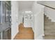 Open foyer with hardwood flooring, a staircase, and access to other rooms in the home at 423 Watershed Dr, Goose Creek, SC 29445