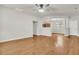 Spacious living room showcasing hardwood floors and an open layout to the kitchen and dining area at 423 Watershed Dr, Goose Creek, SC 29445