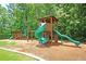 Community playground with a tall slide and train, surrounded by lush greenery at 423 Watershed Dr, Goose Creek, SC 29445