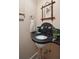 Elegant powder room featuring a unique black marble sink and vintage-inspired mirror at 43 Hasell St, Charleston, SC 29401