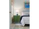 Inviting bedroom with a striped headboard, a vintage lamp, and a rustic, patterned rug at 43 Hasell St, Charleston, SC 29401