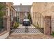 Exterior view of a secured gate offering privacy for parked car at 43 Hasell St, Charleston, SC 29401