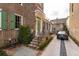Charming two-story brick home with a landscaped yard, inviting entrance, and private driveway at 43 Hasell St, Charleston, SC 29401