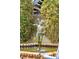Ornate fountain with a bronze statue is surrounded by lush greenery at 43 Hasell St, Charleston, SC 29401