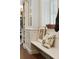 Built in bench next to kitchen cabinets with drawers, bookshelves, and a decorative picture frame at 43 Hasell St, Charleston, SC 29401