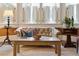 Bright living room showcasing stylish furniture, a bay window, and natural light at 43 Hasell St, Charleston, SC 29401