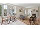 Bright and airy living room featuring large windows and a cozy fireplace with mantel at 43 Hasell St, Charleston, SC 29401