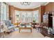 Sunlit living room with bay window, comfortable seating, and elegant decor at 43 Hasell St, Charleston, SC 29401