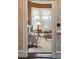 Living room view featuring bay windows and beautiful furnishings, as seen through an interior doorway at 43 Hasell St, Charleston, SC 29401