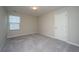 Cozy bedroom featuring neutral walls, plush carpeting, and natural light from a window at 430 Pender Woods Dr, Summerville, SC 29486