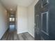 Inviting foyer with wood-look flooring and a view into the adjacent living spaces at 430 Pender Woods Dr, Summerville, SC 29486