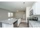 Kitchen with stainless steel appliances and granite countertops open to the living area at 430 Pender Woods Dr, Summerville, SC 29486
