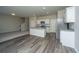 Open kitchen with granite countertops, stainless appliances, and wood flooring at 430 Pender Woods Dr, Summerville, SC 29486