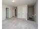 Upstairs loft area with neutral carpet, multiple doors, and ample space at 430 Pender Woods Dr, Summerville, SC 29486