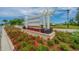 Community sign reads Pender Woods, surrounded by colorful flowers and landscaping at the entrance at 430 Pender Woods Dr, Summerville, SC 29486