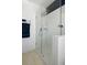 Bathroom features a glass-enclosed shower with white tile and modern fixtures at 4621 Holmes Ave, North Charleston, SC 29405