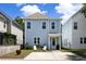 Charming blue two-story home with a cozy front yard and a welcoming entrance at 4621 Holmes Ave, North Charleston, SC 29405