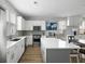 Open kitchen featuring white cabinets, quartz countertops, and stainless steel appliances at 4621 Holmes Ave, North Charleston, SC 29405