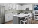 Modern kitchen with white cabinets, quartz countertops, stainless appliances, and a kitchen island at 4621 Holmes Ave, North Charleston, SC 29405
