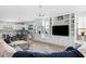 Open concept living room featuring custom built-ins, kitchen, and a sectional sofa at 4621 Holmes Ave, North Charleston, SC 29405