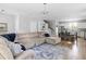 Open concept living room flows into the kitchen with hardwood floors and a sectional sofa at 4621 Holmes Ave, North Charleston, SC 29405