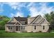 Charming house featuring a covered front porch and lush front lawn at 477 Yellow House Pl, Charleston, SC 29492