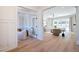 Open-concept design showcases seamless flow between living spaces with hardwood floors at 477 Yellow House Pl, Charleston, SC 29492