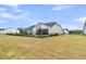 Spacious fenced backyard with a screened-in porch perfect for outdoor entertaining at 511 Ocean Mist Way, Summerville, SC 29486