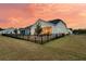 Beautiful fenced backyard with patio and outdoor seating, perfect for entertaining at dusk at 511 Ocean Mist Way, Summerville, SC 29486