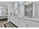 Elegant bathroom with double sinks, quartz countertops, and tiled shower at 511 Ocean Mist Way, Summerville, SC 29486