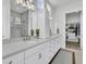 Elegant bathroom featuring dual sinks, quartz countertops, and tiled walk-in shower at 511 Ocean Mist Way, Summerville, SC 29486