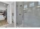 Modern bathroom with glass-enclosed shower and an adjacent walk-in closet at 511 Ocean Mist Way, Summerville, SC 29486