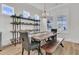 Bright dining room with views of the yard, large windows, wooden table, and a display shelf at 511 Ocean Mist Way, Summerville, SC 29486