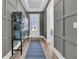 Stylish entryway with wood floors, gray accent wall, and front door with a glass insert allowing natural light at 511 Ocean Mist Way, Summerville, SC 29486