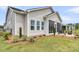 Exterior view of a home with a screened patio, fenced yard, and well-maintained landscaping at 511 Ocean Mist Way, Summerville, SC 29486