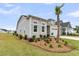 A quaint home with a manicured front yard, featuring a palm tree on a sunny day at 511 Ocean Mist Way, Summerville, SC 29486