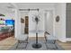 Bright foyer with a marble table, stylish stools, and a sliding barn door leading to another room at 511 Ocean Mist Way, Summerville, SC 29486