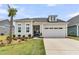 Charming home with a well-manicured lawn, a palm tree, and a two-car garage at 511 Ocean Mist Way, Summerville, SC 29486