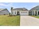Beautiful home with a well-kept lawn, two car garage, and inviting entryway at 511 Ocean Mist Way, Summerville, SC 29486