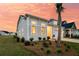 A charming one story home with a well-maintained lawn and landscaping, captured during sunset at 511 Ocean Mist Way, Summerville, SC 29486