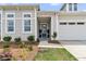 Welcoming home with a beautifully landscaped front yard and an inviting front porch at 511 Ocean Mist Way, Summerville, SC 29486
