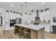 A modern kitchen with stainless steel appliances, a large center island, and pendant lighting at 511 Ocean Mist Way, Summerville, SC 29486