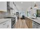 Bright, modern kitchen with stainless steel appliances and gray subway tile backsplash at 511 Ocean Mist Way, Summerville, SC 29486