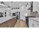 Modern kitchen with a large island, stainless steel appliances, and stylish white cabinetry at 511 Ocean Mist Way, Summerville, SC 29486