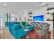Spacious living room featuring modern decor, a plush blue sofa, and natural light at 511 Ocean Mist Way, Summerville, SC 29486