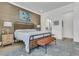 Bright main bedroom boasts textured wall, modern furniture, and luxury rug at 511 Ocean Mist Way, Summerville, SC 29486