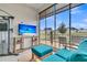 Screened patio with comfortable seating, a TV, and serene views of the backyard at 511 Ocean Mist Way, Summerville, SC 29486