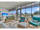 Relaxing screened-in porch with comfortable seating and views of the fenced backyard at 511 Ocean Mist Way, Summerville, SC 29486